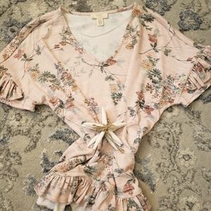 Fun, floral and flirty top!